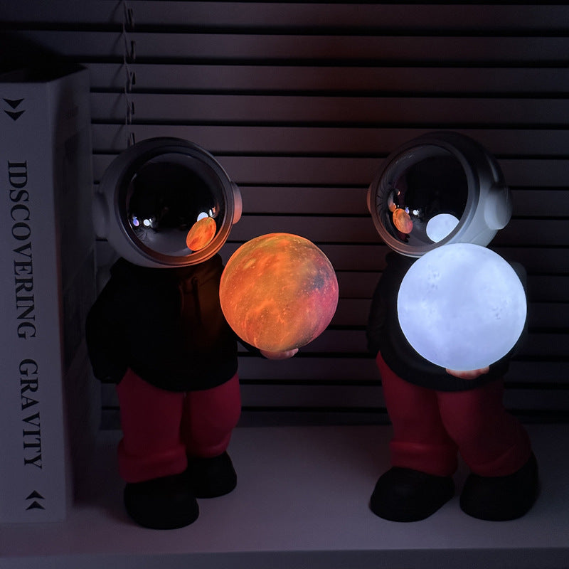 Holding a dreamy starry sky (beige top + brown pants) Creative Astronaut Bluetooth Speaker with 3D Starry Sky Lighting, Portable Wireless Moon Lamp Speaker -Perfect Gift for Space Enthusiasts 3