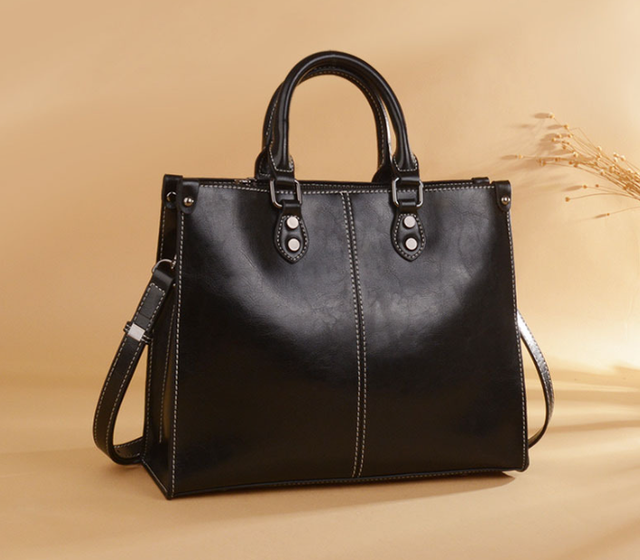 Black Elegant Leather Handbag - StylishTote with Adjustable Strap, Spacious and Durable