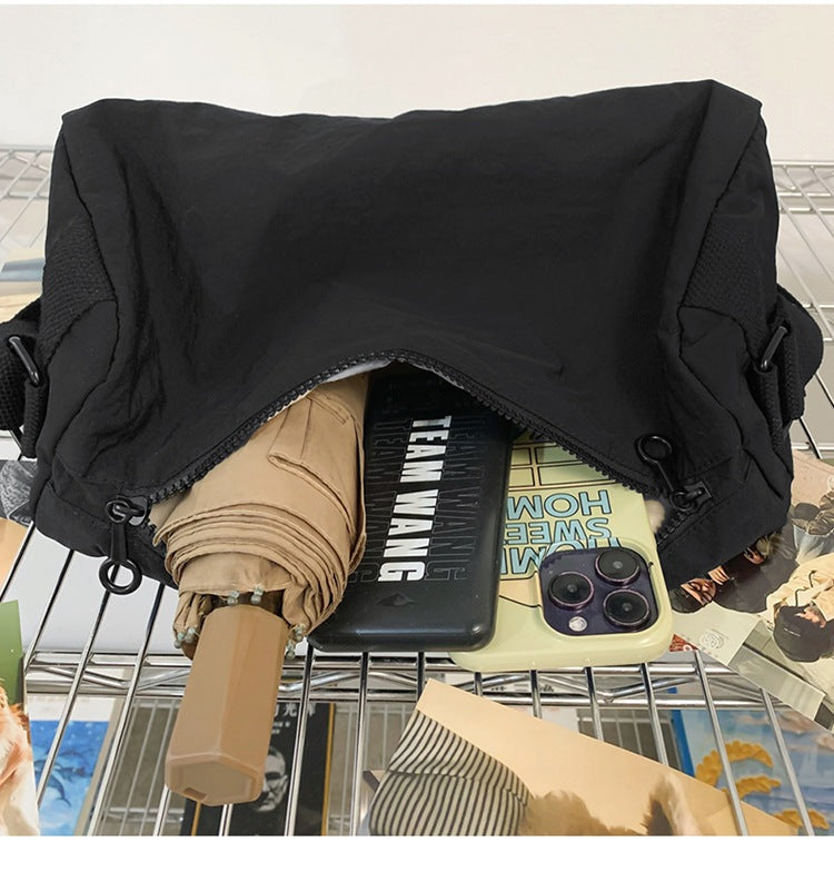 An elegant black shoulder bag for travel and work 4