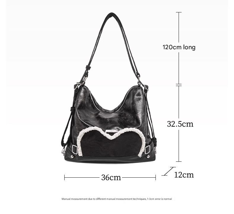 Stylish black tote backpack with heart embellishment - can be worn on one shoulder or as a backpack 4
