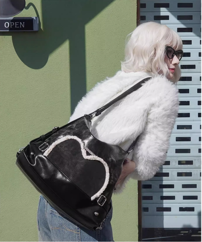 Stylish black tote backpack with heart embellishment - can be worn on one shoulder or as a backpack 8